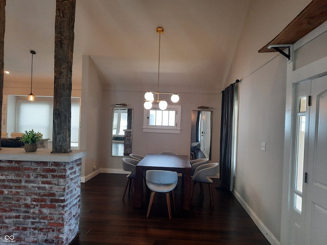 dining area with vaulted ceiling, dark hardwood / wood-style floors, and a chandelier