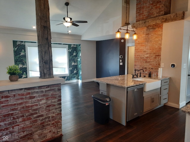 kitchen featuring ceiling fan, dishwasher, sink, decorative light fixtures, and lofted ceiling