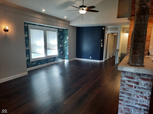 living room with ceiling fan, brick wall, lofted ceiling, and dark wood-type flooring