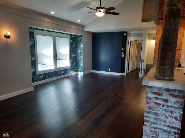 living room with a ceiling fan, dark wood-type flooring, baseboards, and vaulted ceiling