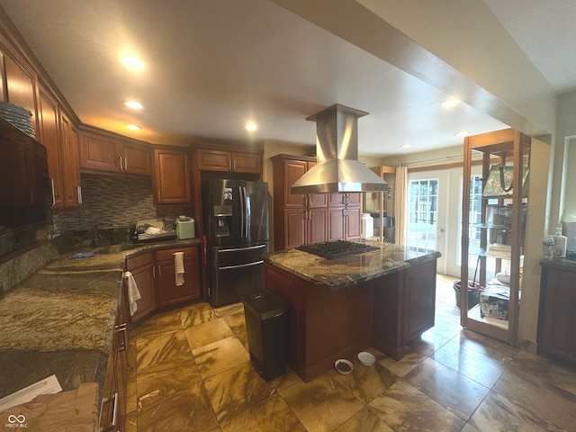 kitchen with backsplash, black gas cooktop, stainless steel refrigerator with ice dispenser, island exhaust hood, and a center island