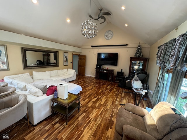 living room with ceiling fan, wood-type flooring, and lofted ceiling