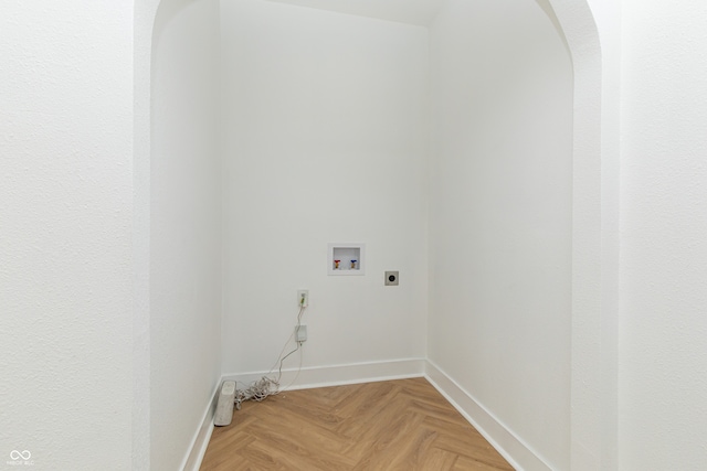 washroom featuring electric dryer hookup, light parquet flooring, and washer hookup