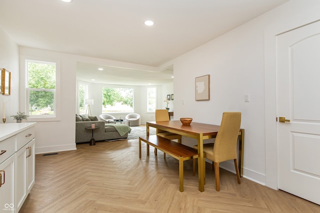 dining area with light parquet floors