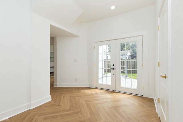 doorway featuring plenty of natural light, light parquet floors, and french doors