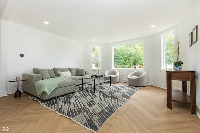 living room featuring a wealth of natural light and light parquet flooring