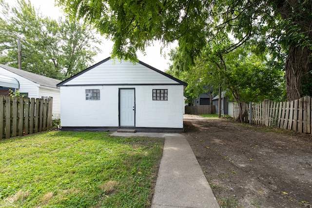 view of outdoor structure with a lawn