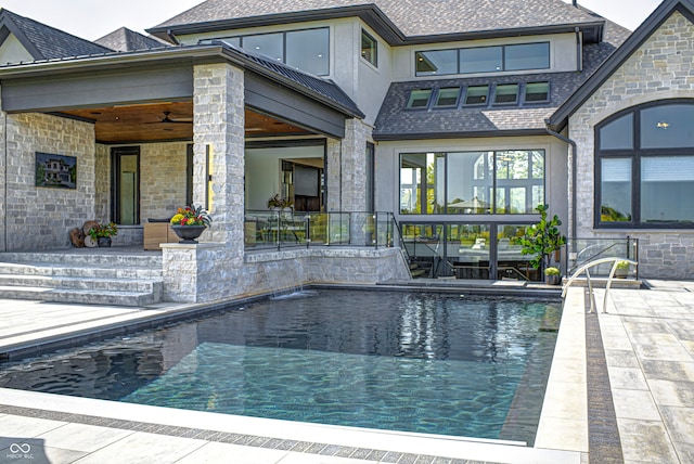 view of pool featuring ceiling fan and a patio