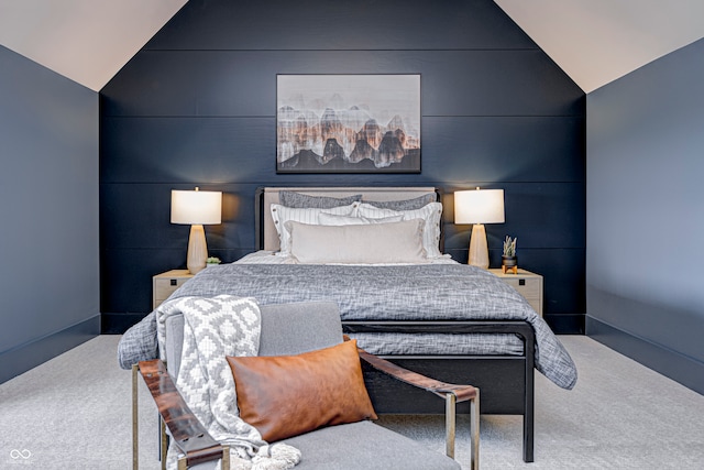 carpeted bedroom featuring vaulted ceiling