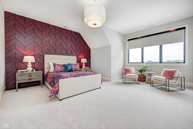 bedroom featuring carpet and vaulted ceiling