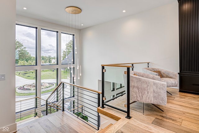 stairway with hardwood / wood-style flooring