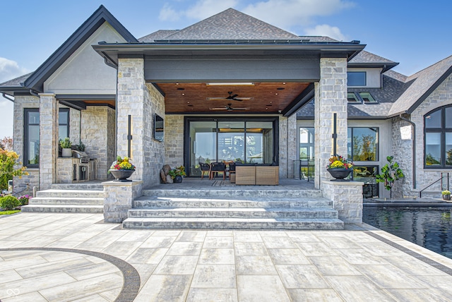 property entrance with a patio and ceiling fan