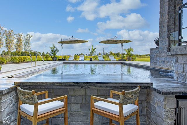 view of swimming pool featuring pool water feature