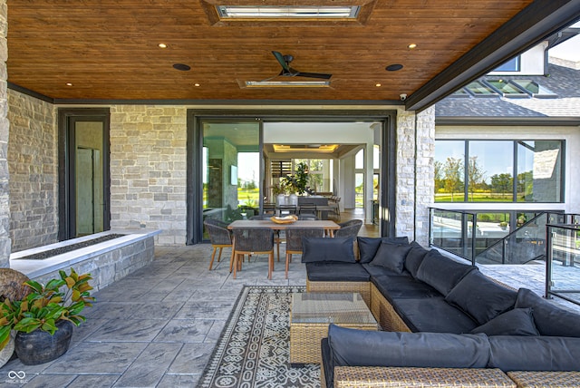 view of patio featuring ceiling fan and outdoor lounge area