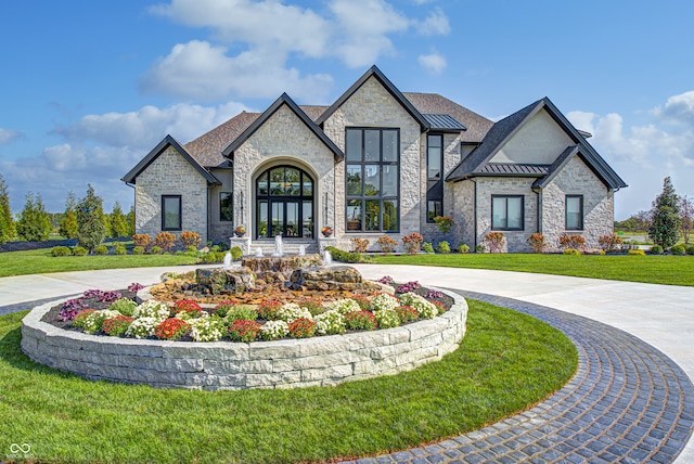 french provincial home with a front yard