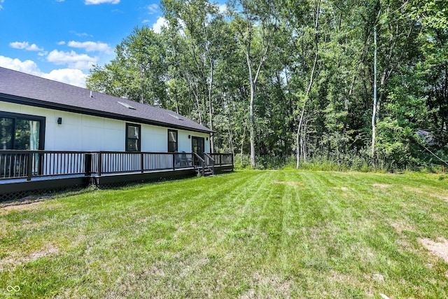 view of yard with a wooden deck