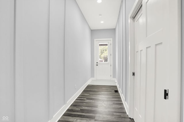 corridor featuring dark hardwood / wood-style flooring