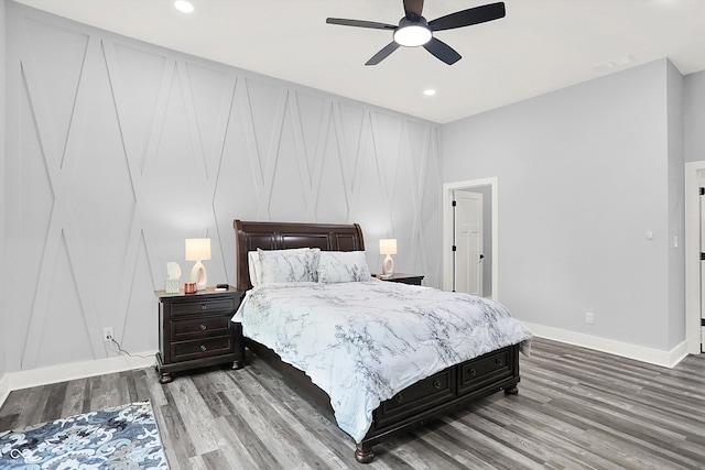 bedroom with wood-type flooring and ceiling fan