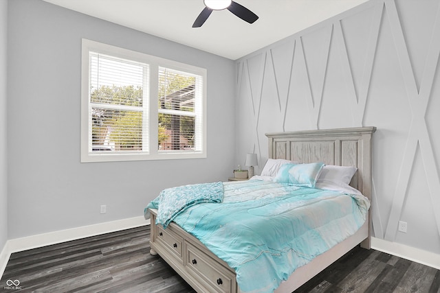 bedroom with ceiling fan and dark hardwood / wood-style flooring