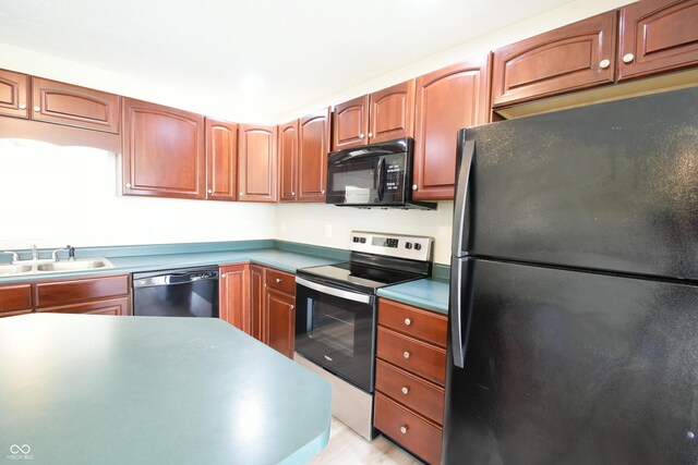 kitchen with black appliances and sink