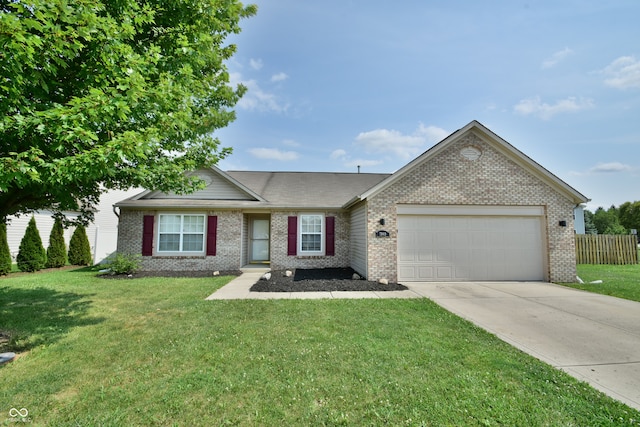 ranch-style home featuring a front lawn and a garage