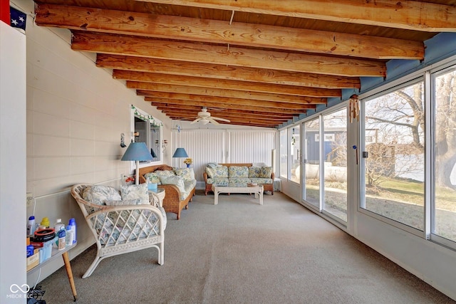 unfurnished sunroom featuring beam ceiling