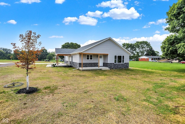 view of front of house featuring a front yard and covered porch