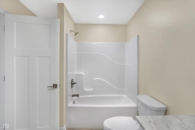 full bathroom featuring bathing tub / shower combination, toilet, and vanity