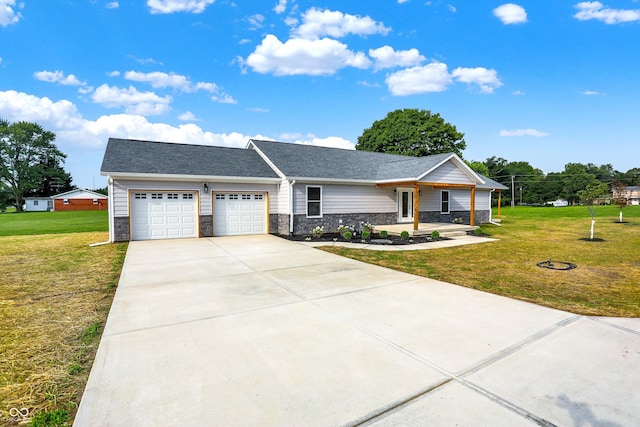 ranch-style home featuring a garage and a front yard