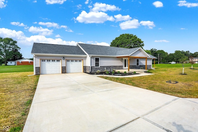 single story home featuring a front lawn and a garage