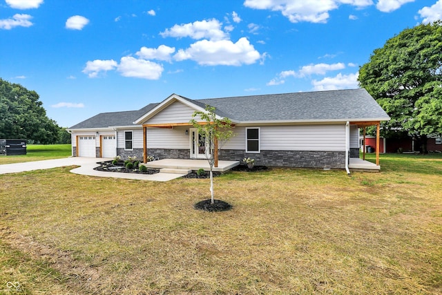 ranch-style house with covered porch, a front yard, and a garage