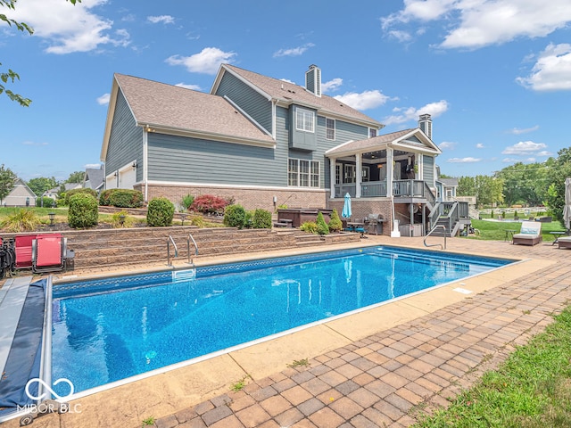 view of swimming pool with a patio area