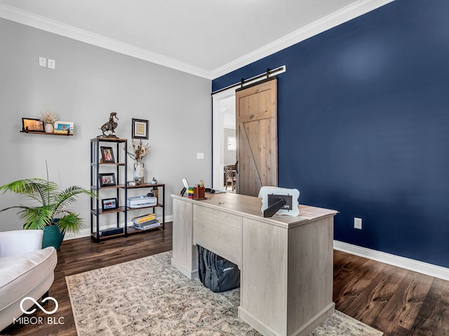 office area with ornamental molding, dark hardwood / wood-style flooring, and a barn door