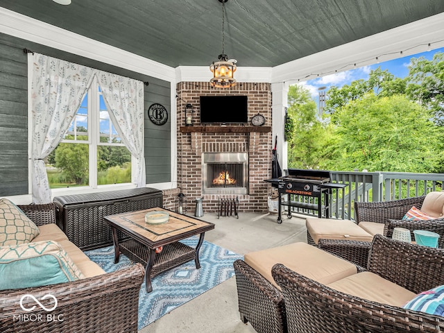 view of patio with an outdoor living space with a fireplace