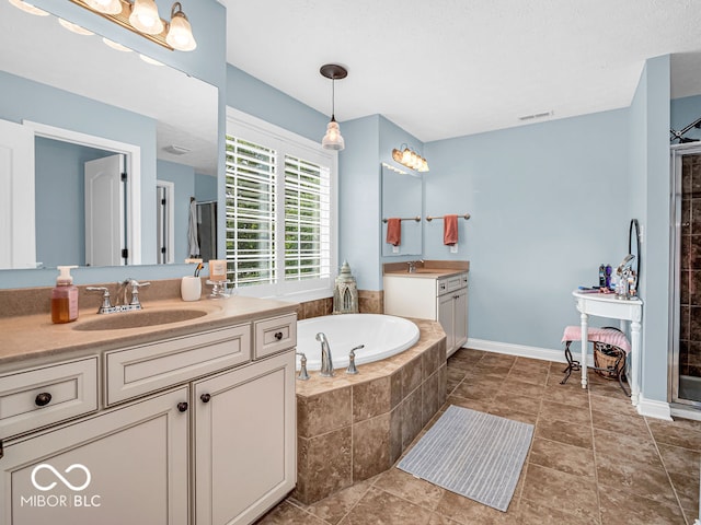 bathroom with vanity, tile patterned floors, and separate shower and tub