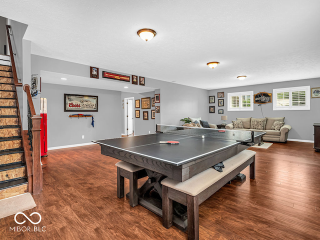 recreation room featuring dark wood-type flooring