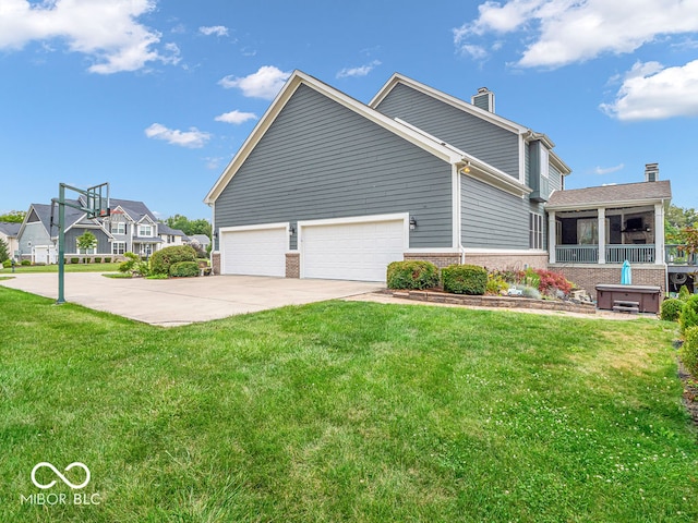 view of front of home with a garage and a front lawn