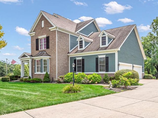 view of front of property featuring a garage and a front yard