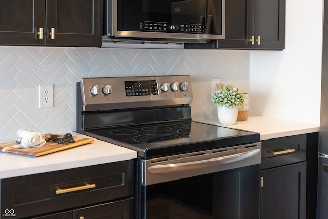 kitchen with tasteful backsplash and stainless steel appliances