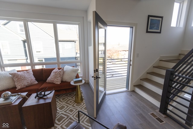 living room featuring a wealth of natural light and wood-type flooring