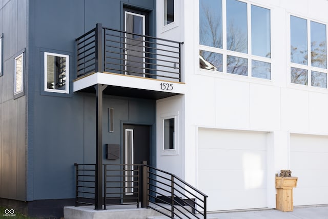 doorway to property with a garage