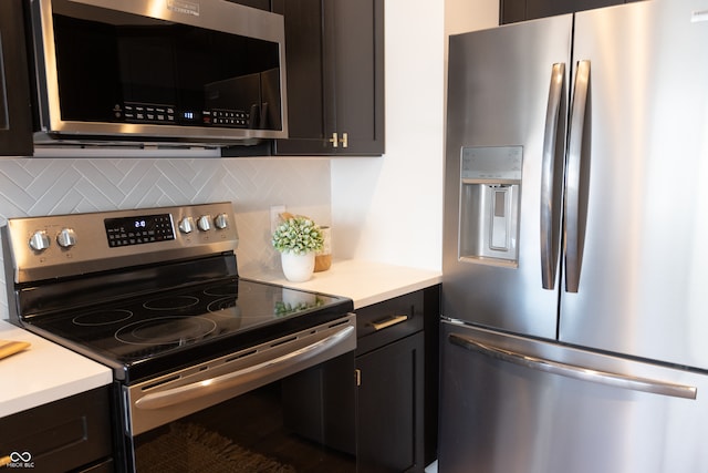 kitchen with decorative backsplash and appliances with stainless steel finishes