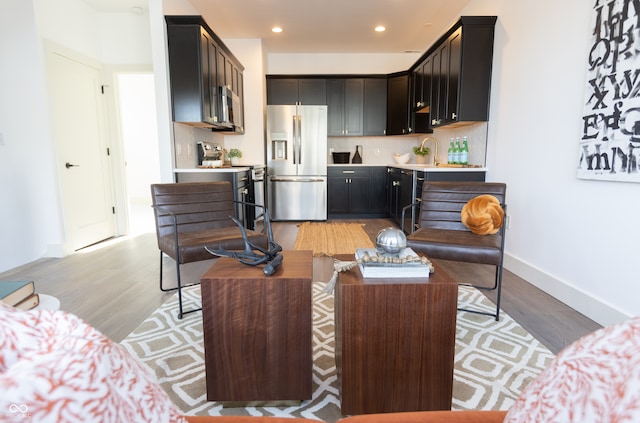 interior space with light hardwood / wood-style floors and sink