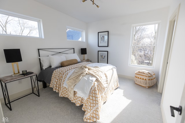 bedroom with light colored carpet