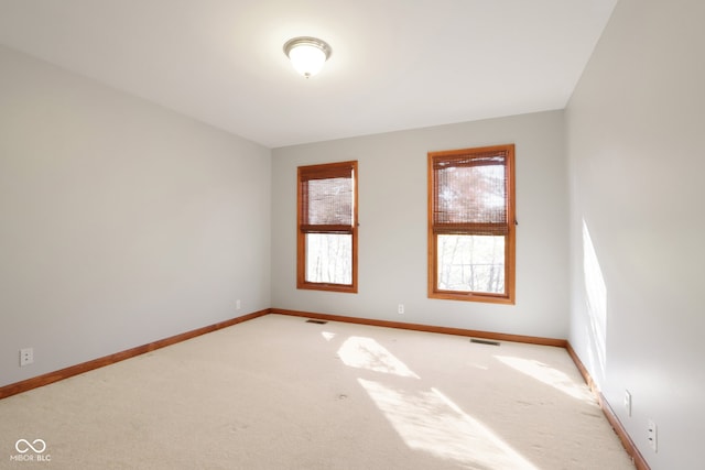 empty room with light colored carpet