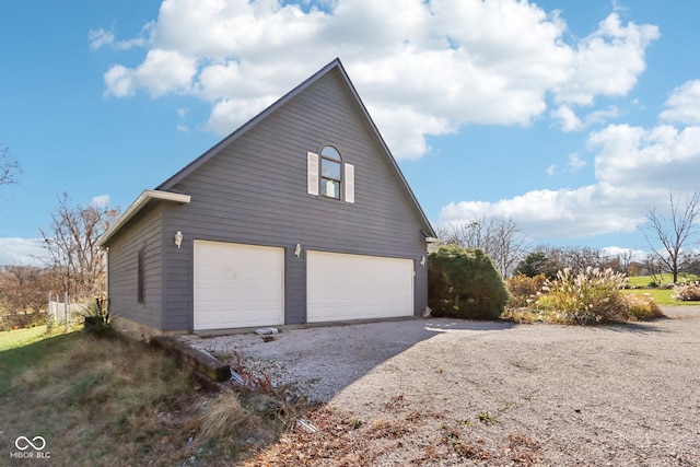 view of property exterior with a garage