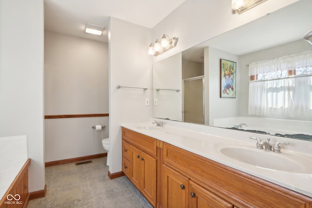 full bathroom with toilet, plus walk in shower, and vanity