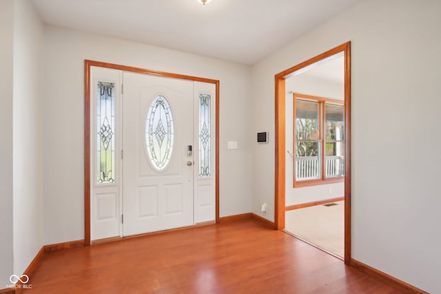 entryway with hardwood / wood-style flooring