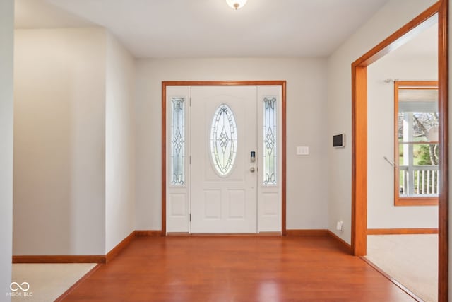 entryway with hardwood / wood-style floors