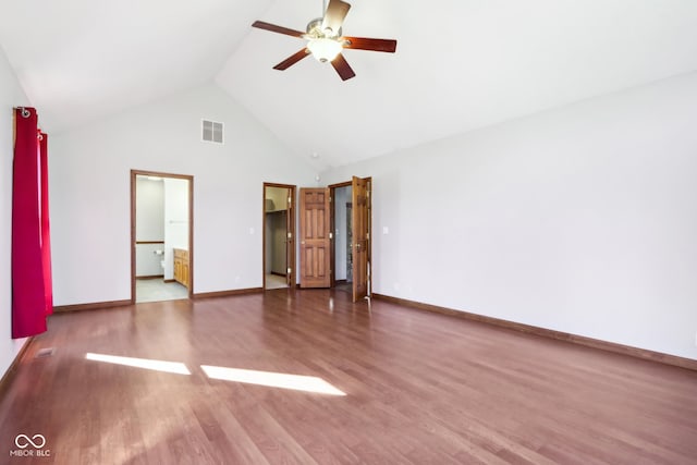 spare room featuring high vaulted ceiling, hardwood / wood-style flooring, and ceiling fan